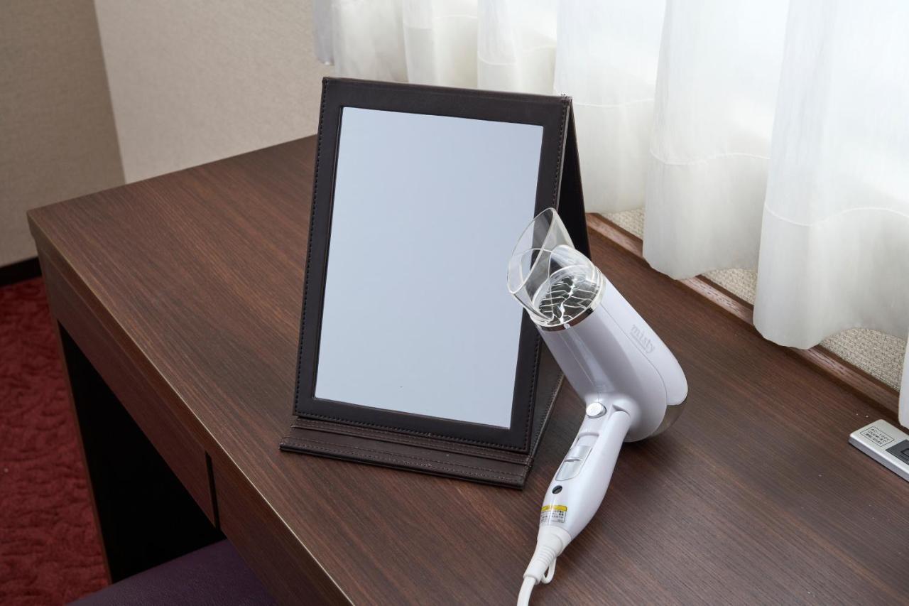 Hotel Axia Inn Sapporo Susukino Bagian luar foto